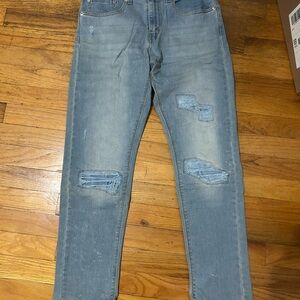 Men's Light Wash Distressed Denim Jeans with Ripped Details